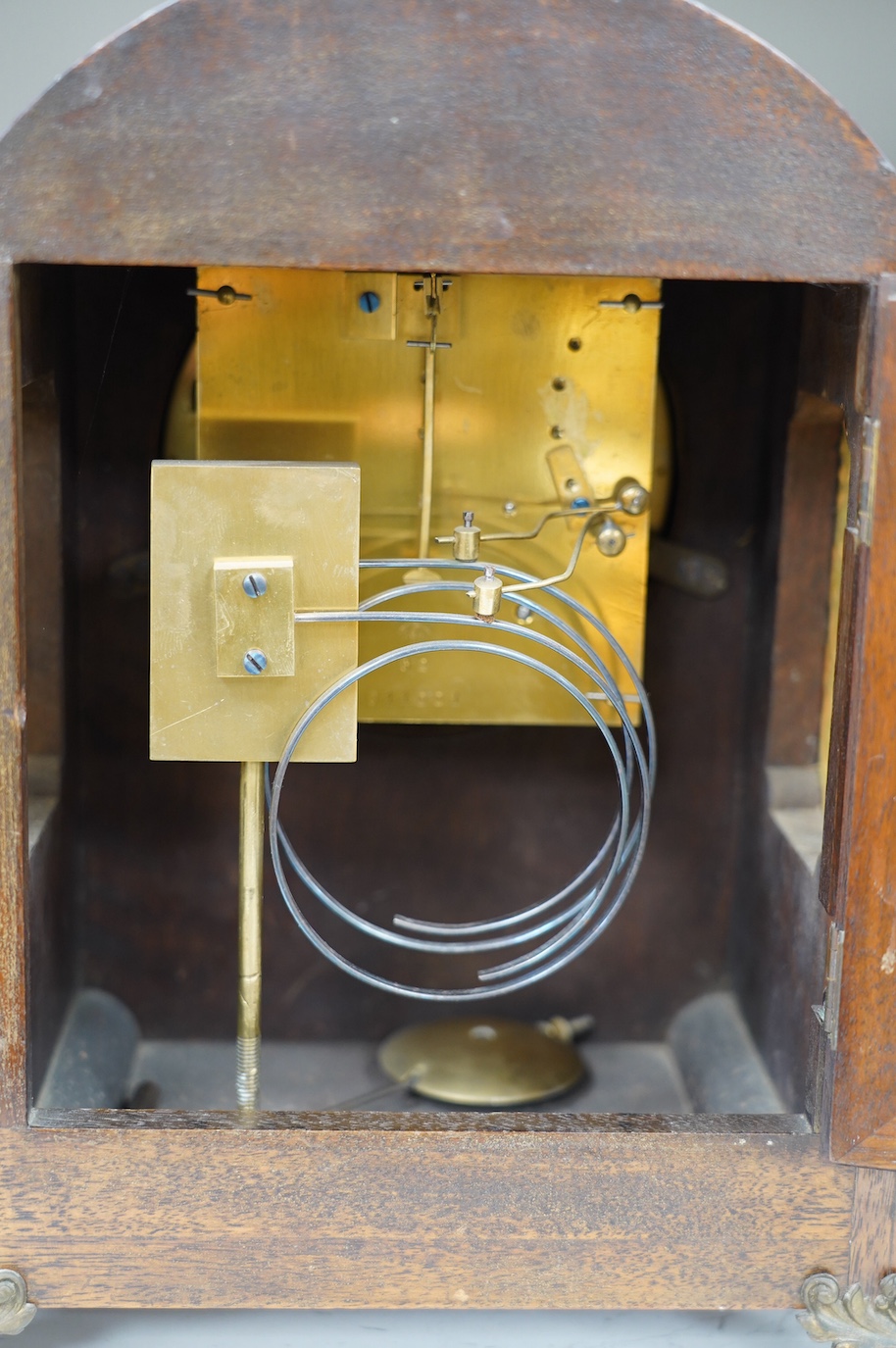 A late 19th century brass mounted burr walnut bracket clock with key and pendulum, and an oak mantel clock, tallest 37cm. Condition - poor to fair